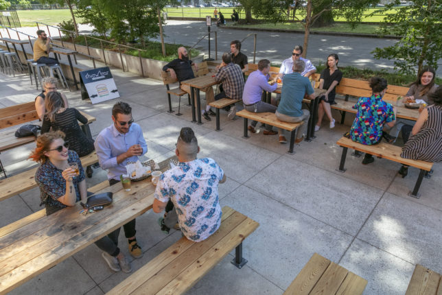 The outdoor seating area at show bar, with Washington Dog Park in the backdrop