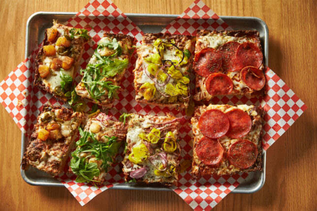 The Detroit-style pizza from show bar, overhead view, many flavors